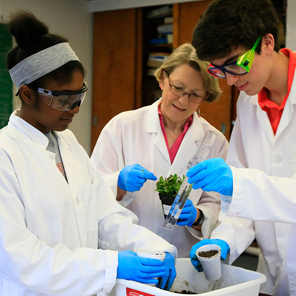 Students and teacher in science class