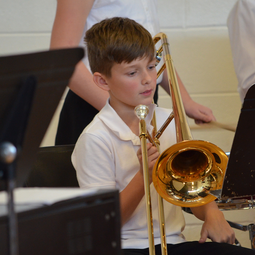 young student playing trumbone