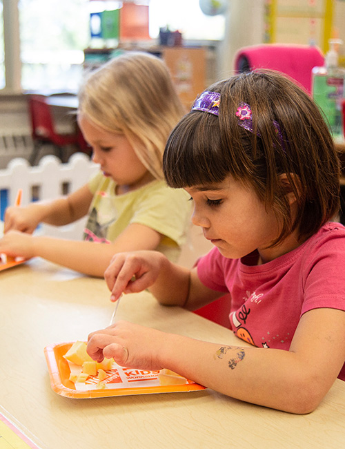 Lower School students learning to use knives